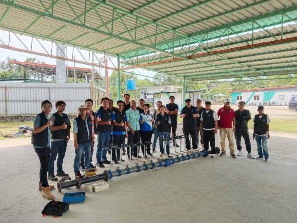 Participants practising pipe assembly during SPA’s water reticulation training with ABM and CIDB